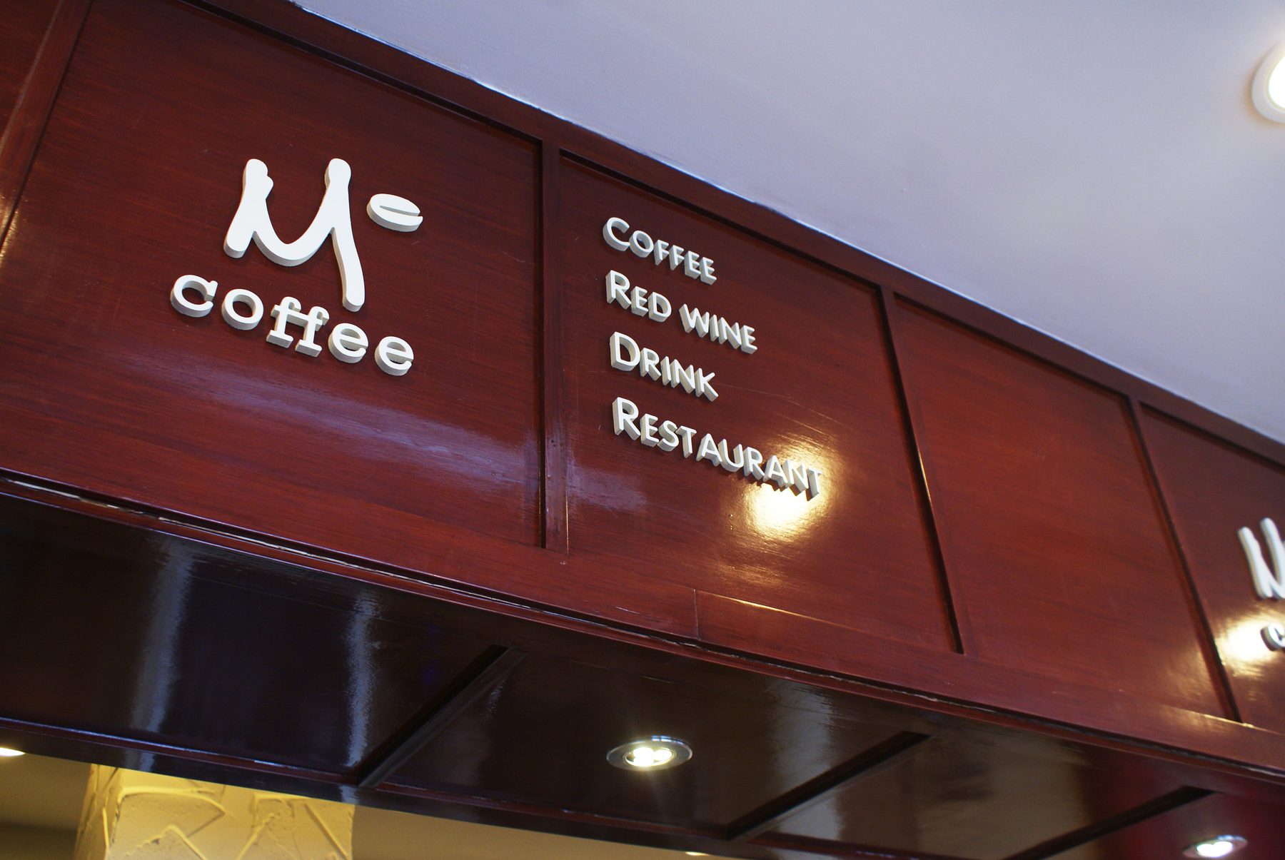M° Coffee — logo and shopfront signage
